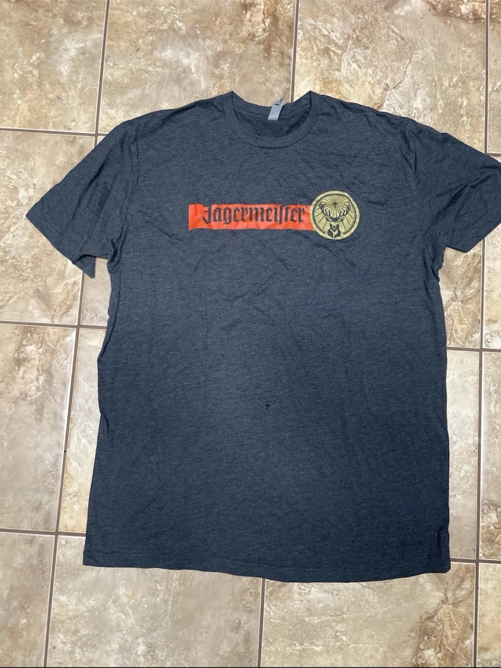 Jagermeister Charcoal Short-Sleeve Tee with Red Logo and Gold Emblem